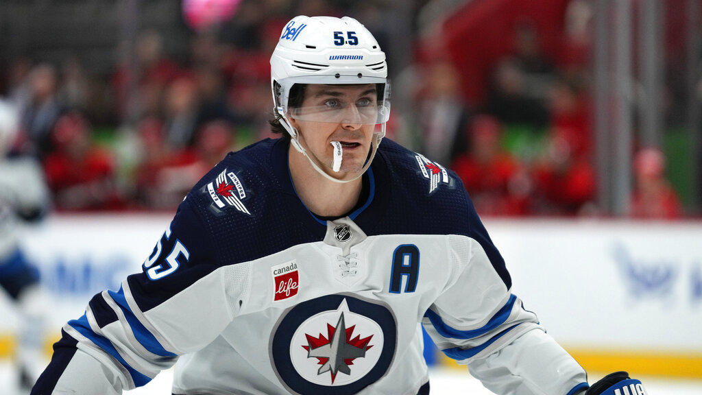 Winnipeg Jets center Mark Scheifele (55) plays against the Detroit Red Wings in the first period of an NHL hockey game Tuesday, Jan. 10, 2023, in Detroit. (AP Photo/Paul Sancya)