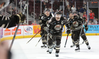 Led by captain Dylan McIlrath, the Hershey Bears celebrate a goal against the Charlotte Checkers in the 2023 Calder Cup Playoffs.