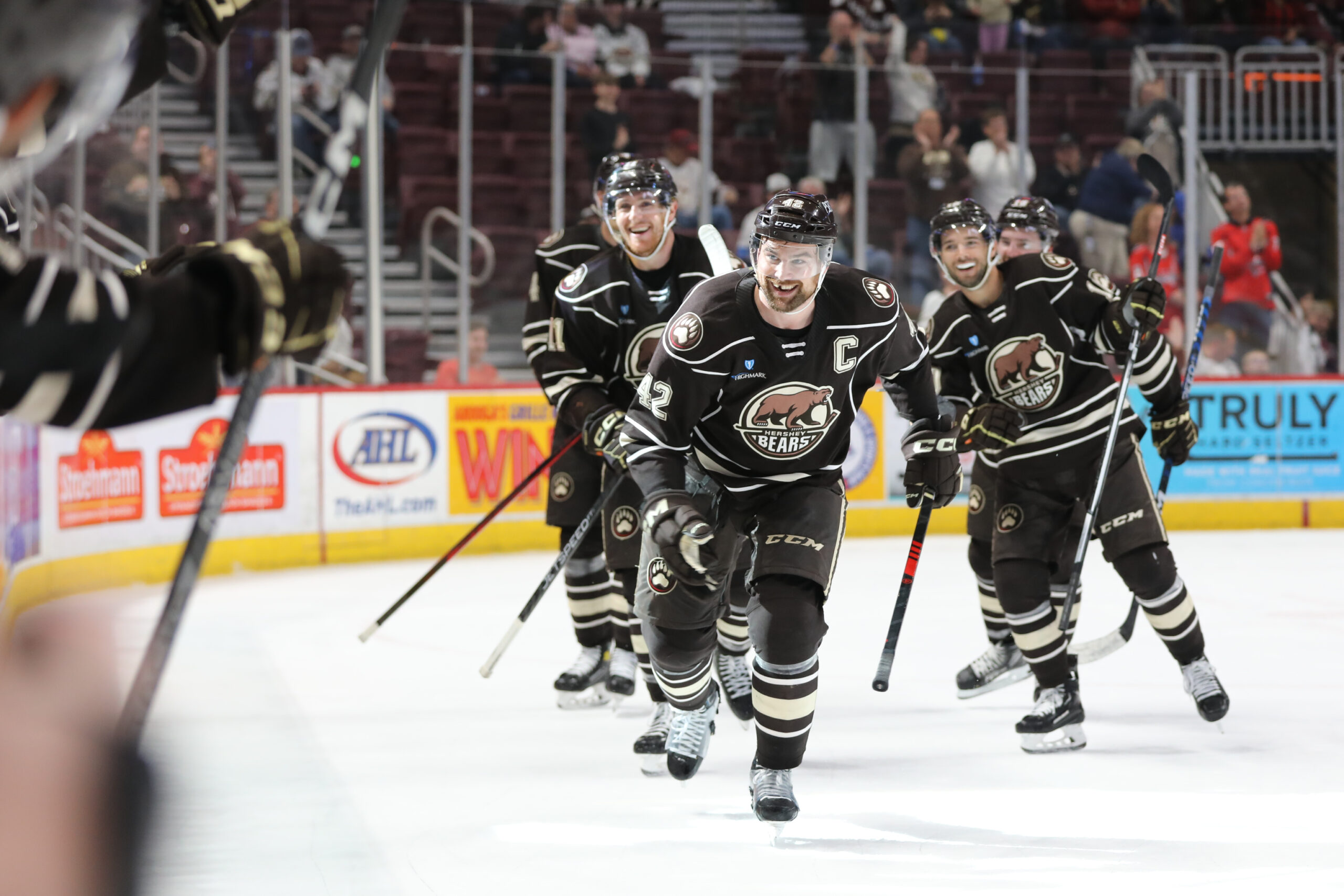Led by captain Dylan McIlrath, the Hershey Bears celebrate a goal against the Charlotte Checkers in the 2023 Calder Cup Playoffs.